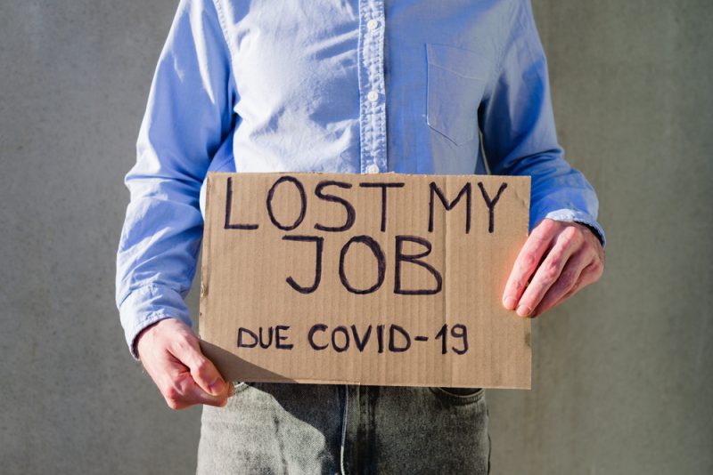Man,Office,Worker,In,Blue,Shirt,With,Cardboard,Sign,Lost