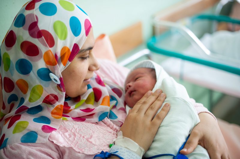 Arabic,Muslim,Mother,Carrying,Her,Child,In,Hospital,Bed,Immediately